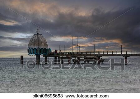 Stock Image - Diving gondola and pier at the beach of Zingst at sunrise, Zingst, peninsula Zingst, Daß, Fischland, Baltic Sea, Mecklenburg-Western Pomerania, East Germany. Fotosearch