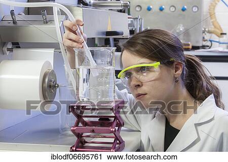 Doctoral student during her research work on a film drawing bench at the Institute for Pharmaceutical Technology and Biopharmacy at Heinrich-Heine-University Düsseldorf, North Rhine-Westphalia, Germany, Europe View Large Photo Image Stock Image - Doctoral student during her research work on a film drawing bench at the Institute for Pharmaceutical Technology and Biopharmacy at Heinrich-Heine-University Düsseldorf, North Rhine-Westphalia, Germany, Europe. Fotosearch