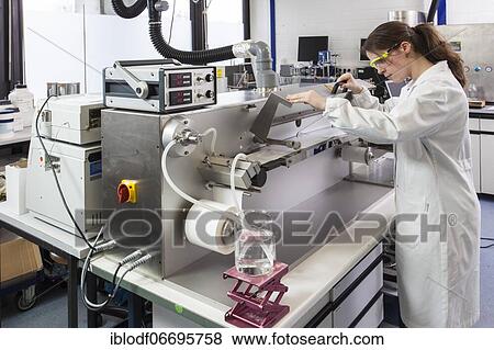 Doctoral student during her research work on a film drawing bench at the Institute for Pharmaceutical Technology and Biopharmacy at Heinrich-Heine-University Düsseldorf, North Rhine-Westphalia, Germany, Europe View Large Photo Image Stock Photo - Doctoral student during her research work on a film drawing bench at the Institute for Pharmaceutical Technology and Biopharmacy at Heinrich-Heine-University Düsseldorf, North Rhine-Westphalia, Germany, Europe. Fotosearch