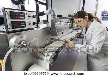Doctoral student during her research work on a film drawing bench at the Institute for Pharmaceutical Technology and Biopharmacy at Heinrich-Heine-University Düsseldorf, North Rhine-Westphalia, Germany, Europe View Large Photo Image Stock Photo - Doctoral student during her research work on a film drawing bench at the Institute for Pharmaceutical Technology and Biopharmacy at Heinrich-Heine-University Düsseldorf, North Rhine-Westphalia, Germany, Europe. Fotosearch