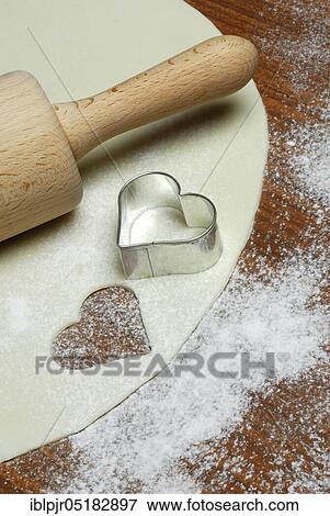 Dough, cookie dough, cookie dough, cookie cutter, cookie, biscuits, cookie cutter, heart shape, heart-shaped, dough roll, pastry, bakery products, baking, cookies View Large Photo Image Stock Photo - Dough, cookie dough, cookie dough, cookie cutter, cookie, biscuits, cookie cutter, heart shape, heart-shaped, dough roll, pastry, bakery products, baking, cookies. Fotosearch