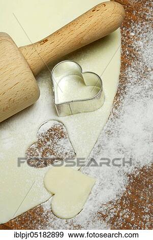 Dough, cookie dough, cookie dough, cookie cutter, cookie, biscuits, cookie cutter, heart shape, heart-shaped, dough roll, pastry, bakery products, baking, cookies View Large Photo Image Stock Photo - Dough, cookie dough, cookie dough, cookie cutter, cookie, biscuits, cookie cutter, heart shape, heart-shaped, dough roll, pastry, bakery products, baking, cookies. Fotosearch