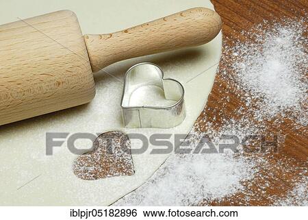 Dough, cookie dough, cookie dough, cookie cutter, cookie, biscuits, cookie cutter, heart shape, heart-shaped, dough roll, pastry, bakery products, baking, cookies View Large Photo Image Stock Photograph - Dough, cookie dough, cookie dough, cookie cutter, cookie, biscuits, cookie cutter, heart shape, heart-shaped, dough roll, pastry, bakery products, baking, cookies. Fotosearch