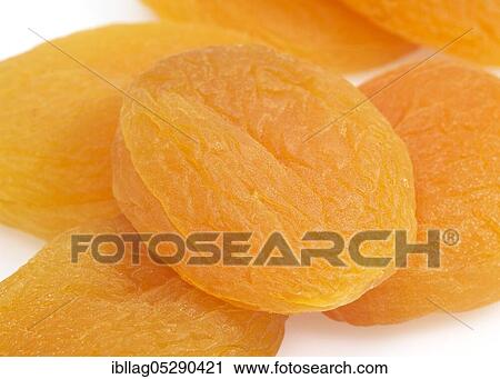 Stock Image - Dried apricot (Prunus armeniaca), dried fruit against white background. Fotosearch