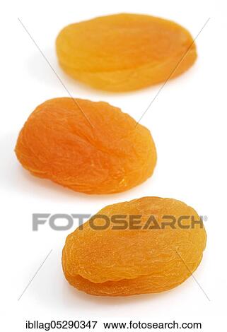 Dried apricots (Prunus armeniaca) against white background View Large Photo Image Stock Photo - Dried apricots (Prunus armeniaca) against white background. Fotosearch