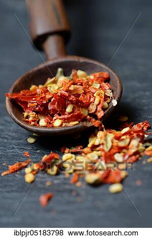 Dried chili peppers with wooden spoon, chili flakes, cayenne, paprika, chili pepper, hot pepper, tabasco, piri-piri View Large Photo Image Stock Photo - Dried chili peppers with wooden spoon, chili flakes, cayenne, paprika, chili pepper, hot pepper, tabasco, piri-piri. Fotosearch