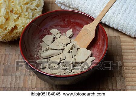 Stock Photography - Dried healing clay in bowl, red clay, clay, healing clay powder. Fotosearch