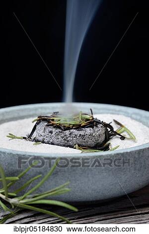 Dried rosemary leaves are burnt in a bowl with sand View Large Photo Image Stock Image - Dried rosemary leaves are burnt in a bowl with sand. Fotosearch