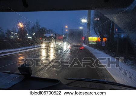 Driving a truck at dawn in winter with poor visibility and road conditions View Large Photo Image Stock Image - Driving a truck at dawn in winter with poor visibility and road conditions. Fotosearch