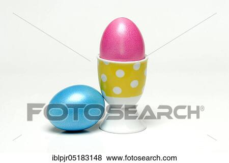 Easter egg in egg cup, coloured eggs, hen's egg View Large Photo Image Stock Photo - Easter egg in egg cup, coloured eggs, hen's egg. Fotosearch