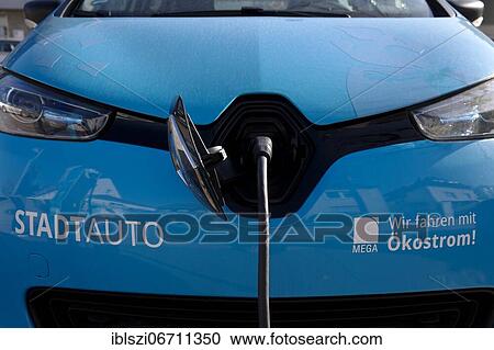 Electric car charging as city car for rent, Monheim am Rhein, North Rhine-Westphalia, Germany, Europe View Large Photo Image Stock Image - Electric car charging as city car for rent, Monheim am Rhein, North Rhine-Westphalia, Germany, Europe. Fotosearch