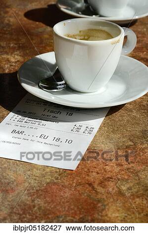 Stock Photo - Empty cup of espresso and receipt, espresso cup, receipt, coffee, receipt. Fotosearch