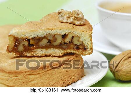 Stock Image - Engadine nut cake, cake, walnut, short pastry with caramel and walnuts, plate, cake plate. Fotosearch