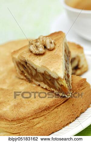 Stock Image - Engadine nut cake, cake, walnut, short pastry with caramel and walnuts, plate, cake plate. Fotosearch