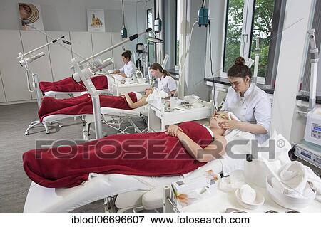 Stock Photo - Facial massage in practical lessons. Training as a beautician at the vocational school, Düsseldorf, North Rhine-Westphalia, Germany, Europe. Fotosearch