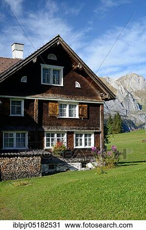 Stock Image - Farmhouse with wooden shingles, near Wildhaus, Toggenburg, Canton St. Gallen, Switzerland, Europe. Fotosearch