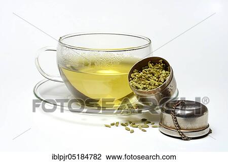 Stock Image - Fennel tea in cup and fennel seeds in spoon, fennel tea. Fotosearch