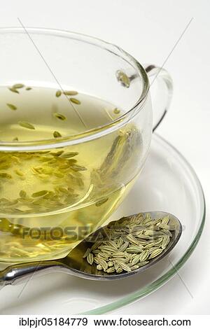 Stock Photo - Fennel tea in cup and fennel seeds in spoon, fennel tea. Fotosearch
