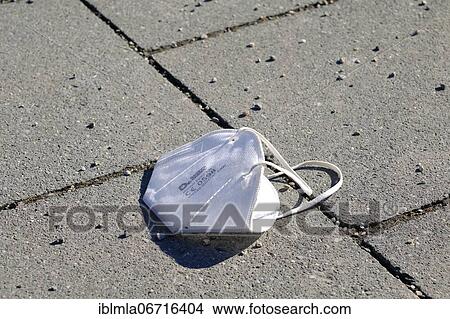 FFP 2 mask lying on pedestrian walkway, Germany, Europe View Large Photo Image Picture - FFP 2 mask lying on pedestrian walkway, Germany, Europe. Fotosearch