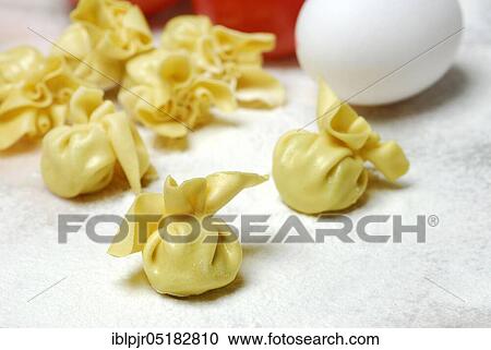 Stock Image - Filled pastry beads, pearl al basilico, pasta, pasta, pastry beads. Fotosearch