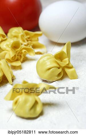 Stock Image - Filled pastry beads, pearl al basilico, pasta, pasta, pastry beads. Fotosearch