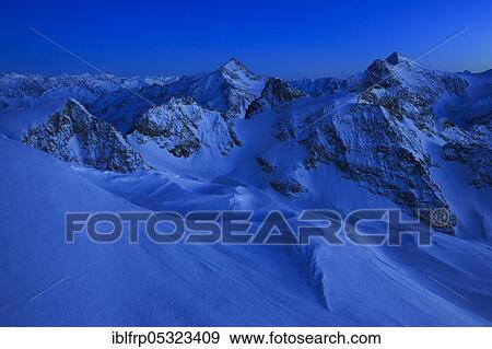 Stock Photo - Fleckistock and Sustenhorn, view from Titlis, Alps of Uri, Alps of Central Switzerland, Central Switzerland, Switzerland, Europe. Fotosearch