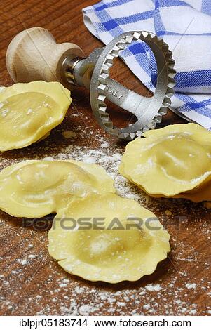 Fresh ravioli with ravioli cutter, pasta, cookie cutter View Large Photo Image Picture - Fresh ravioli with ravioli cutter, pasta, cookie cutter. Fotosearch