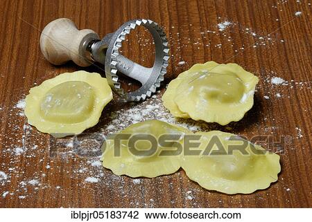 Fresh ravioli with ravioli cutter, pasta, cookie cutter View Large Photo Image Stock Image - Fresh ravioli with ravioli cutter, pasta, cookie cutter. Fotosearch
