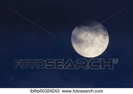 Stock Image - Full moon, Scotland, Great Britain. Fotosearch