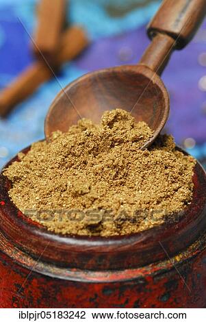 Stock Image - Garam Masala, Indian spice powder, spice mix, spoon. Fotosearch