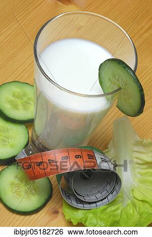 Glass of buttermilk, cucumber, lettuce leaf, milk, straw, lettuce, lettuce, cucumber, measuring tape View Large Photo Image Stock Photograph - Glass of buttermilk, cucumber, lettuce leaf, milk, straw, lettuce, lettuce, cucumber, measuring tape. Fotosearch