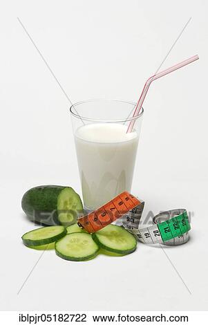 Glass of buttermilk, cucumber, milk, straw, cucumber, measuring tape View Large Photo Image Stock Image - Glass of buttermilk, cucumber, milk, straw, cucumber, measuring tape. Fotosearch