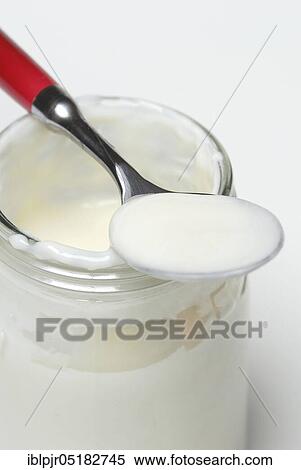 Stock Photography - Glass of yoghurt, dairy products, natural yoghurt. Fotosearch