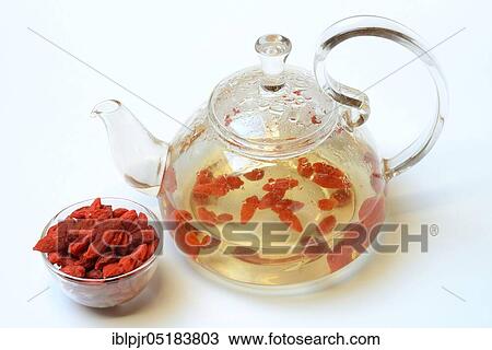 Stock Image - Goji berry ( Lycium barbarum) in a bowl, scurvy, tea. Fotosearch