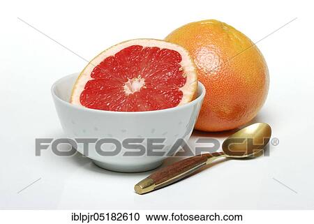 Stock Image - Grapefruit and spoon ( Citrus maxima, Citrus x paradisi). Fotosearch