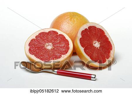 Stock Image - Grapefruit and spoon ( Citrus maxima, Citrus x paradisi). Fotosearch