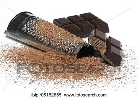 Stock Photography - Grated dark chocolate, chocolate pieces, chocolate shavings, chocolate coating, grater. Fotosearch