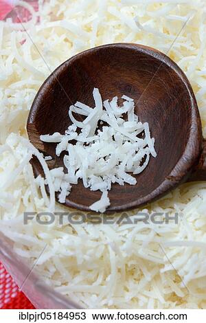 Grated Parmesan cheese in glass bowl with wooden spoon, Parmigiano Reggiano View Large Photo Image Stock Image - Grated Parmesan cheese in glass bowl with wooden spoon, Parmigiano Reggiano. Fotosearch