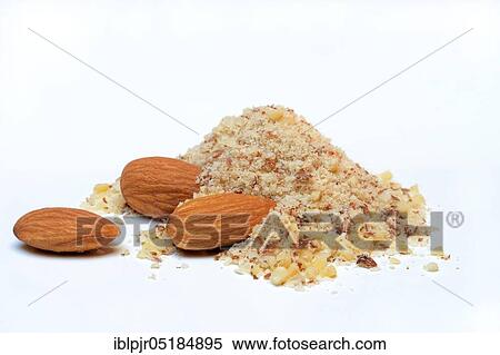 Stock Photography - Ground almonds and sweet almonds, almonds with skin ( Prunus dulcis). Fotosearch