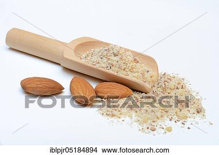 Picture - Ground almonds, scoop and sweet almonds, almonds with skin ( Prunus dulcis). Fotosearch