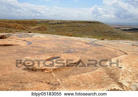 Stock Photography - Göbekli Tepe, Southeast Anatolia, near Sanliurfa, Mesopotamia, Stone Age, Stone Age mountain sanctuary, stone slab for pillars, view in Harran plain, excavations, excavation site, prehistoric, archaeology, Turkey, Asia. Fotosearch