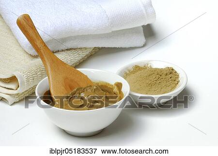 Stock Photo - Healing earth, clay, red clay mixed with water, healing earth powder. Fotosearch