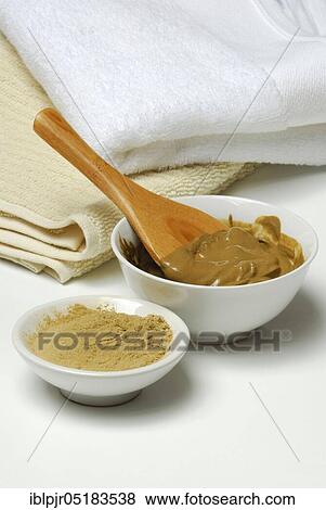 Stock Photo - Healing earth, clay, red clay mixed with water, healing earth powder. Fotosearch