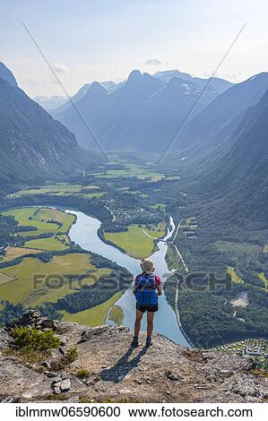Stock Image - Hiker on the Romsdalseggen hike, mountain ridge, Rauma River, Romsdalfjellene Mountains, Andalsnes, Møre og Romsdal, Norway, Europe. Fotosearch