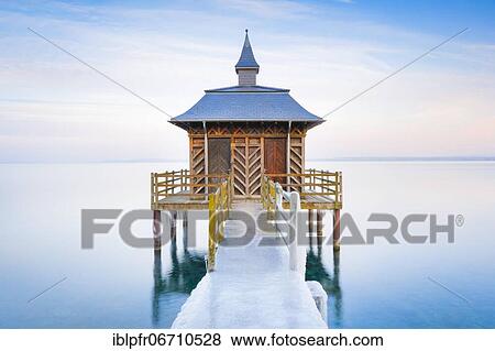 Stock Photo - Iced bathhouse at dusk, Lake Neuchâtel, Gorgier, Neuchâtel, Switzerland, Europe. Fotosearch