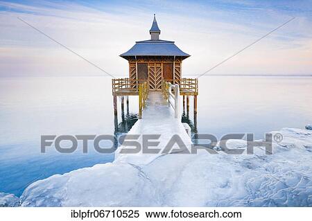 Stock Photography - Iced bathhouse at dusk, Lake Neuchâtel, Gorgier, Neuchâtel, Switzerland, Europe. Fotosearch