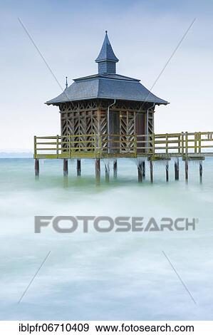 Stock Photo - Iced bathhouse in stormy wind, Lake Neuchâtel, Gorgier, Neuchâtel, Switzerland, Europe. Fotosearch