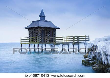 Stock Image - Iced bathhouse, Lake Neuchâtel, Gorgier, Neuchâtel, Switzerland, Europe. Fotosearch