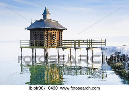 Stock Image - Iced bathhouse, Lake Neuchâtel, Gorgier, Neuchâtel, Switzerland, Europe. Fotosearch
