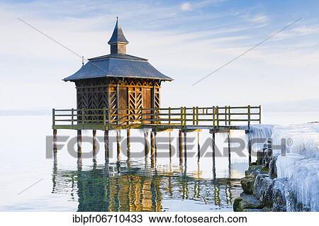 Stock Image - Iced bathhouse, Lake Neuchâtel, Gorgier, Neuchâtel, Switzerland, Europe. Fotosearch